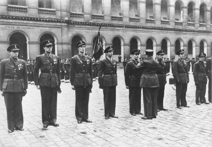 From left to right, Haukelid, Paulsson, Rønneberg, Kayser,Kjelstrup, Haugland, Strømsheim, and Storhaug receive official honors for their service.