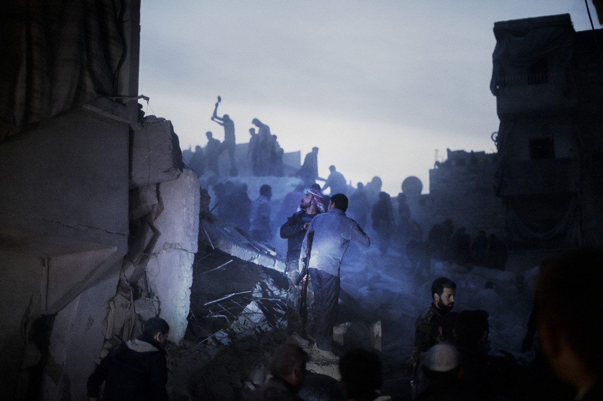 Aleppo, Syria. March, 2013. Searching for survivors in the aftermath of bombardment by regime warplanes in a rebel-held residential district in Aleppo.