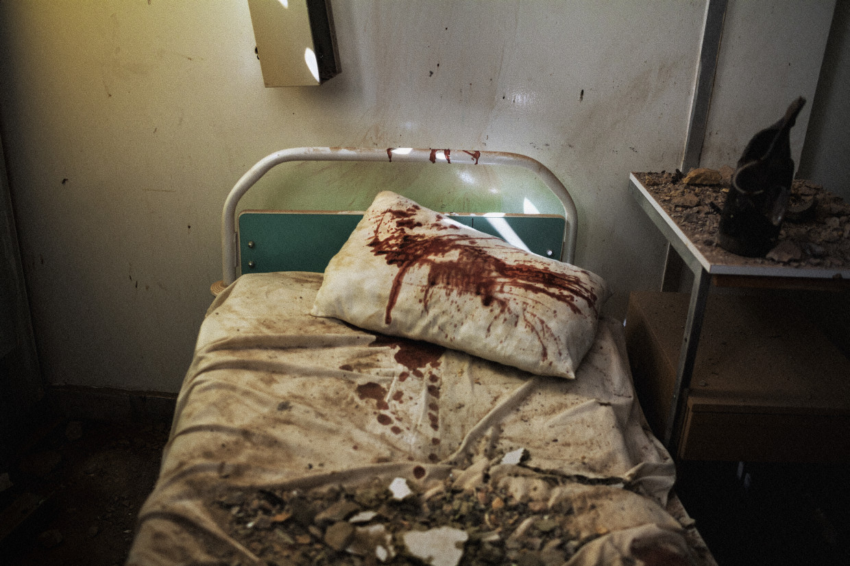 Zlitan, Libya. March, 2011. Fake blood spilled in a hospital bed at the site of an alleged NATO airstrike in the city of Zlitan.