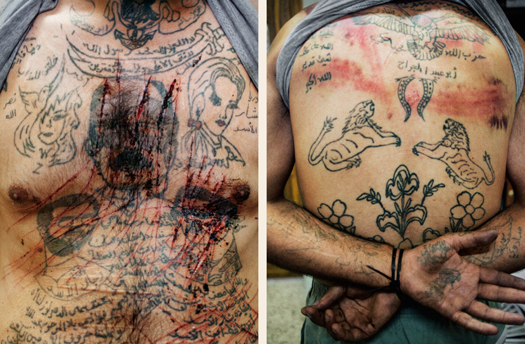Marae, Syria. July, 2012. The torso and back of Zakariyya Gazmouz, a suspected Shabiha prisoner, his body covered in pro-Assad tattoos that he later defaced with a razor.