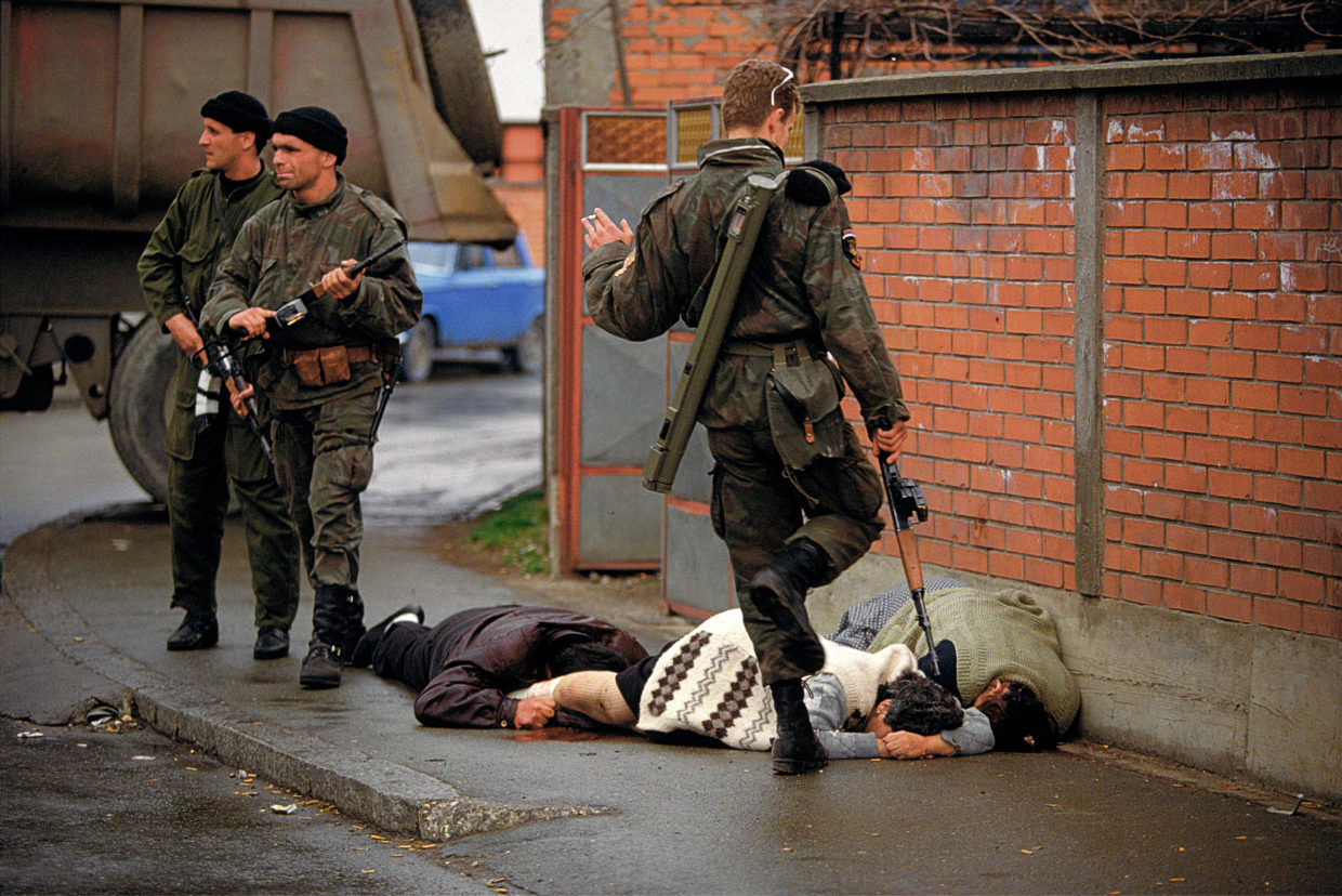 Arkan's Tigers kill and kick Bosnian Muslim civilians during the first battle for Bosnia in Bijeljina, Bosnia, March 31, 1992. The Serbian paramilitary unit was responsible for killing thousands of people during the Bosnian war, and Arkan was later indicted for war crimes.