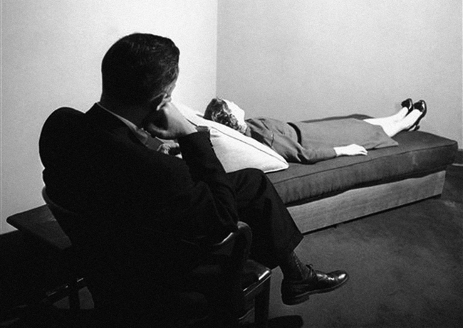 A psychoanalyst listens to a patient digging into her past at the New York Psychoanalytic Institute Treatment Center in New York City, 1956. Courtesy of Redstone Press.