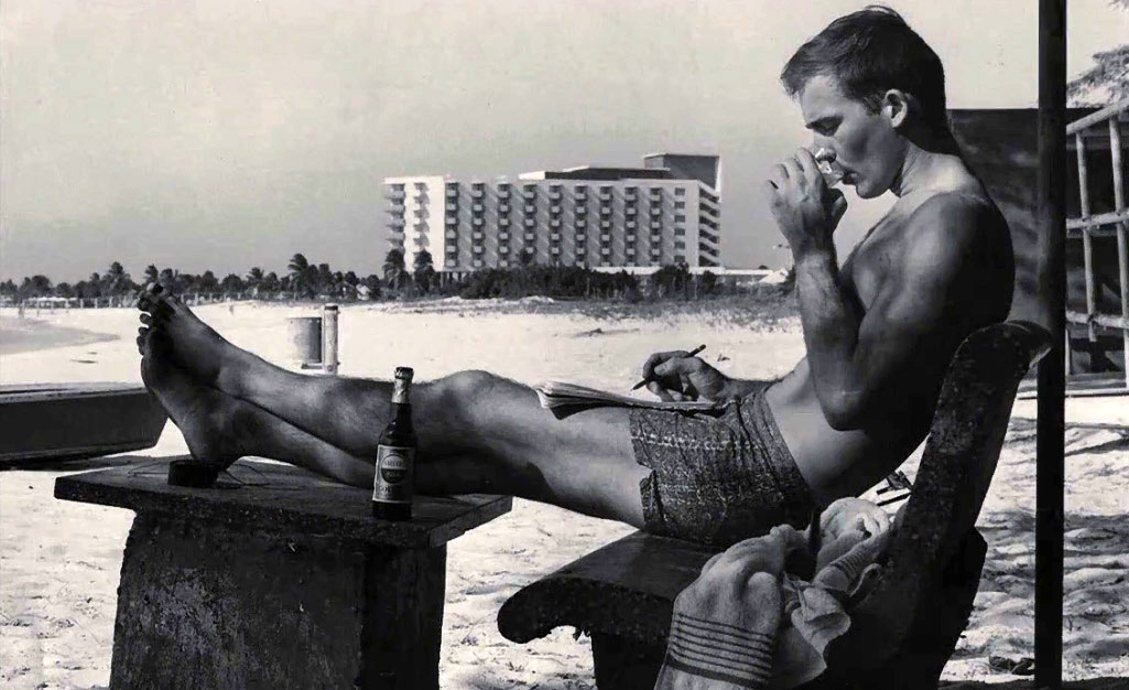 Hunter S. Thompson, writing on the beach